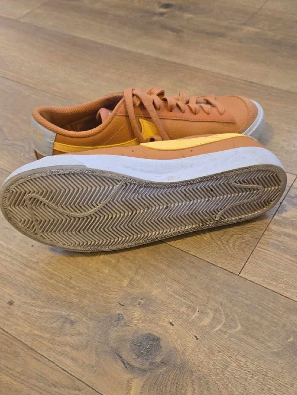 Nike Kids Low-Top Sneakers in Burnt Orange with Yellow Swoosh